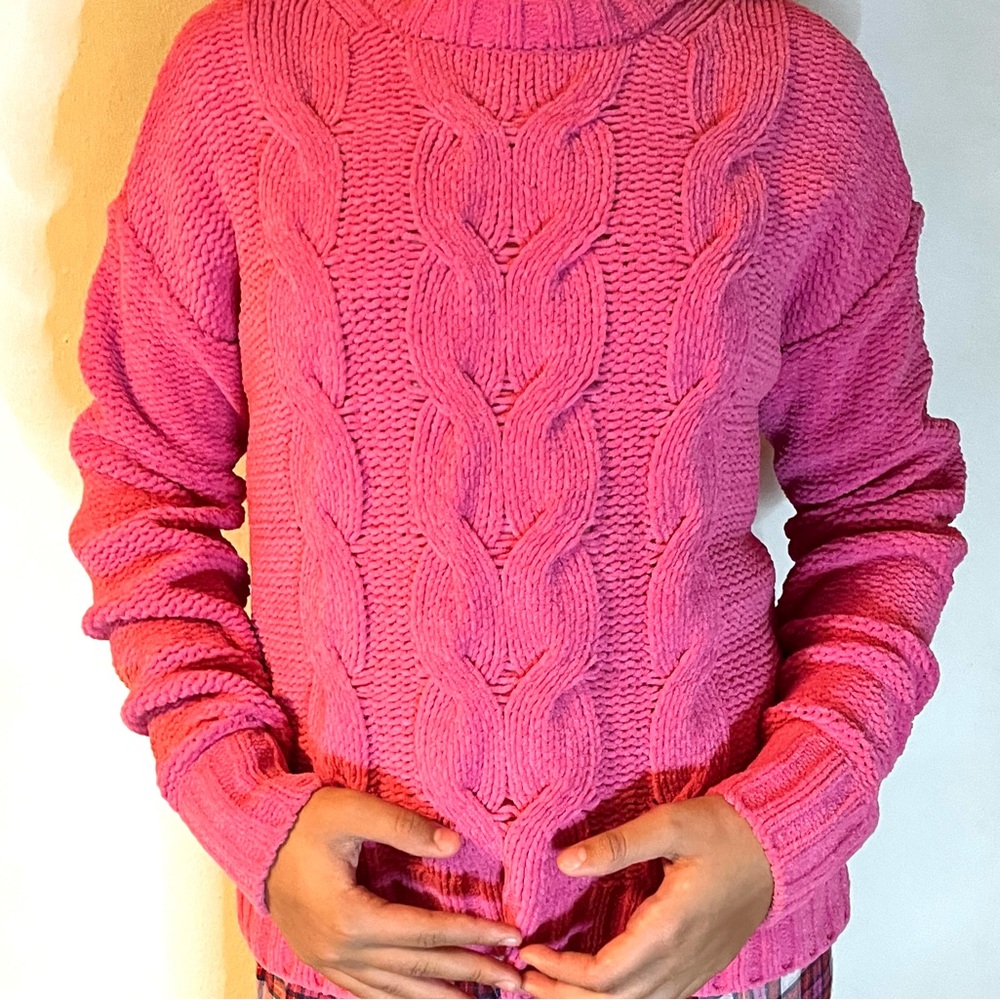 Soft tube pink sweater cozy feel to it looks great with Jeans.